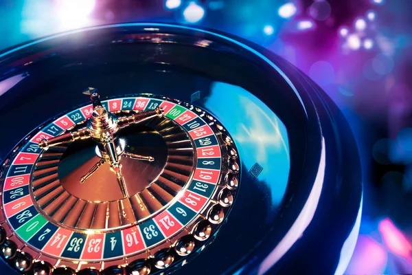 Roulette wheel spinning with betting layout visible on screen